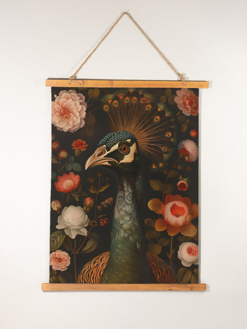 A wall tapestry featuring a detailed Victorian-style illustration of a peacock head with ornate feathers, surrounded by coral and white roses against a dark background, mounted on wooden dowels.